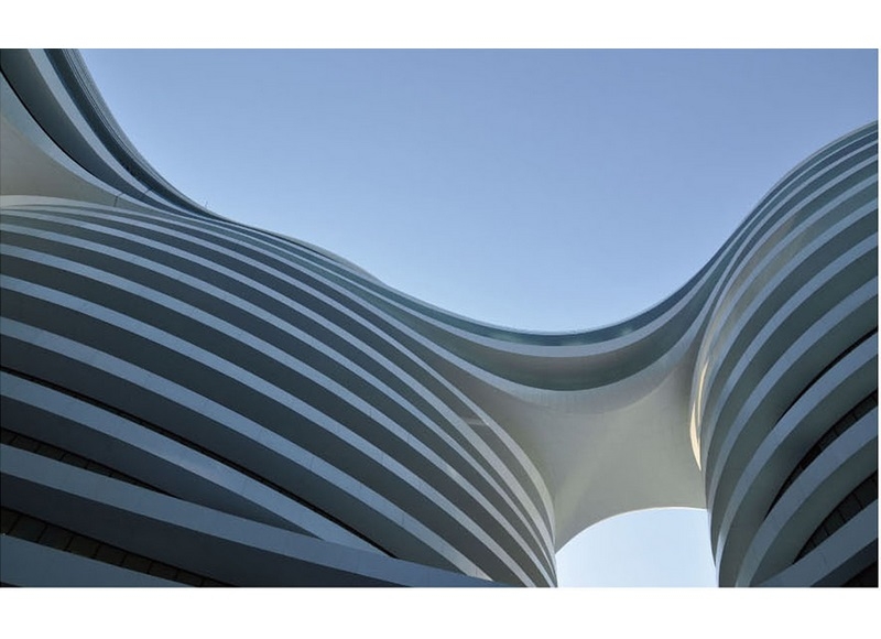 Double curvature aluminum veneer